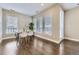 Bright dining area with hardwood floors, large windows, and modern decor at 2374 S University Blvd # 402, Denver, CO 80210