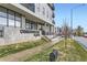 Beautiful condo building featuring modern architectural design, signage and manicured lawn at 2374 S University Blvd # 402, Denver, CO 80210