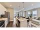 Modern open floor plan boasts stainless steel appliances and an island with barstool seating at 2374 S University Blvd # 402, Denver, CO 80210