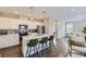 Well-equipped modern kitchen with island seating, stainless appliances, and sleek countertops at 2374 S University Blvd # 402, Denver, CO 80210