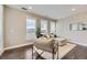 Open-concept living room with ample natural light, stylish furnishings, and neutral color palette at 2374 S University Blvd # 402, Denver, CO 80210