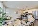 Open living space showcasing stylish seating flowing into a modern kitchen with stainless appliances at 2374 S University Blvd # 402, Denver, CO 80210
