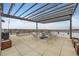 Rooftop patio area featuring a metal pergola with string lights, a fire pit and seating for entertaining at 2374 S University Blvd # 402, Denver, CO 80210