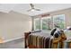 Bright bedroom with large windows offers a view of the trees and features a rustic wood bed frame at 31189 Manitoba Dr, Evergreen, CO 80439