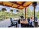 Inviting outdoor deck area, furnished with cozy seating, a heater, and beautiful views of the surrounding landscape at 31189 Manitoba Dr, Evergreen, CO 80439