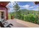Relaxing backyard deck with scenic views, perfect for outdoor enjoyment and entertaining at 31189 Manitoba Dr, Evergreen, CO 80439
