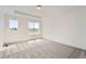 Bright and airy bedroom with neutral carpet, white walls and ceiling and large windows at 1224 S Algonquian St, Aurora, CO 80018