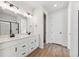Stylish bathroom features double vanity, modern fixtures, and ample counter space at 1300 Sienna Peak Cir, Erie, CO 80516