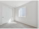 Neutral bedroom with double door closet and natural light at 1300 Sienna Peak Cir, Erie, CO 80516