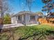 Spacious backyard with a patio, grassy area, and a privacy fence at 20 S Harrison St, Denver, CO 80209