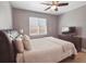 Comfortable bedroom with a ceiling fan, window views, and a relaxing ambiance for restful nights at 20 S Harrison St, Denver, CO 80209