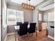 Bright dining area with modern lighting, seating for four, and wood floors at 20 S Harrison St, Denver, CO 80209