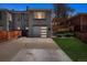 Charming exterior with well-manicured lawn, driveway, and pergola at 20 S Harrison St, Denver, CO 80209