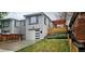 Charming home with modern garage door, landscaped yard and a covered patio at 20 S Harrison St, Denver, CO 80209
