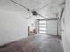 Spacious garage interior with white door and overhead lighting at 20 S Harrison St, Denver, CO 80209