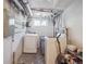 Basement laundry room with white washer and dryer at 20 S Harrison St, Denver, CO 80209