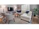 Inviting living room with a sectional sofa, area rug, and contemporary furniture for relaxation and entertaining at 20 S Harrison St, Denver, CO 80209