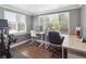 Well-lit office featuring multiple workstations and large windows for natural light at 20 S Harrison St, Denver, CO 80209