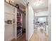 Organized pantry with shelving and sliding door near the living area at 20 S Harrison St, Denver, CO 80209