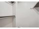 Walk-in closet offering ample storage with shelving and metal hanging rods for organized convenience at 4114 S Niagara Way, Denver, CO 80237