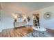 Open-concept living room with hardwood floors and stylish decor at 4114 S Niagara Way, Denver, CO 80237