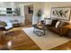 Cozy living room with hardwood floors, stylish furnishings, and an open layout at 4114 S Niagara Way, Denver, CO 80237