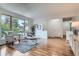 Comfortable living room with a large window offering natural light and views of the outdoors at 4114 S Niagara Way, Denver, CO 80237