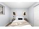 Comfortable bedroom featuring neutral walls, carpet, and art at 16259 W 10Th Ave # I2, Golden, CO 80401