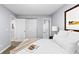 Bedroom with neutral walls, plush carpeting, closet and an ensuite bathroom at 16259 W 10Th Ave # I2, Golden, CO 80401