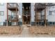 A view of the exterior of the apartment building with balconies and a walkway entrance at 16259 W 10Th Ave # I2, Golden, CO 80401