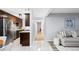 An open-concept floor plan with a modern kitchen and living area, featuring stainless steel appliances and a cozy sofa at 16259 W 10Th Ave # I2, Golden, CO 80401