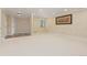 Basement area with neutral carpeting, an egress window, and a walkout door at 8361 Piney Creek Rd, Parker, CO 80138