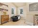 Bathroom showcases a clawfoot tub, and custom vanity with decorative tile at 8361 Piney Creek Rd, Parker, CO 80138