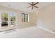 Light-filled bedroom with a walkout to the backyard and a charming landscape view at 8361 Piney Creek Rd, Parker, CO 80138
