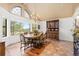 Bright dining room featuring a large window, elegant chandelier, and spacious dining table for memorable gatherings at 8361 Piney Creek Rd, Parker, CO 80138