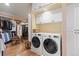 Convenient laundry room with modern washer and dryer units and ample storage space at 8361 Piney Creek Rd, Parker, CO 80138