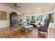 Bright living room features hardwood floors, large windows, and stylish decor at 8361 Piney Creek Rd, Parker, CO 80138