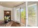 Cozy living room featuring a fireplace, hardwood floors, and sliding doors to a private balcony with views at 8361 Piney Creek Rd, Parker, CO 80138