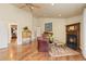 Inviting living room with hardwood floors, a fireplace, and elegant decor at 8361 Piney Creek Rd, Parker, CO 80138