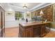 This office boasts a stately wooden desk, a large patterned rug, and soft, natural lighting at 8361 Piney Creek Rd, Parker, CO 80138