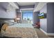 Bright bedroom features a skyline view, comfortable queen bed and chic wall decor at 2001 Lincoln St # 2420, Denver, CO 80202
