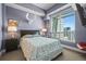 Bright bedroom features a skyline view, comfortable queen bed and chic wall decor at 2001 Lincoln St # 2420, Denver, CO 80202