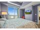Bright bedroom features a skyline view, comfortable queen bed and chic wall decor at 2001 Lincoln St # 2420, Denver, CO 80202