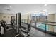 Well-equipped gym on the second floor overlooking the pool with city views at 2001 Lincoln St # 2420, Denver, CO 80202