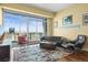 Bright living room featuring floor-to-ceiling windows with city views, modern furniture, and elegant hardwood floors at 2001 Lincoln St # 2420, Denver, CO 80202