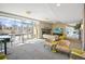 Bright lounge with fireplace, comfortable seating, patio access and city views at 2001 Lincoln St # 2420, Denver, CO 80202