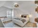 Well-lit bedroom with a sloped ceiling, modern decor and a cozy ambiance at 748 Elati St, Denver, CO 80204
