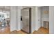 Modern kitchen with stainless steel refrigerator and view into eat-in kitchen and living area at 748 Elati St, Denver, CO 80204