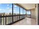 Balcony with glass enclosure and views of the complex and neighborhood buildings at 13601 E Marina Dr # 604, Aurora, CO 80014