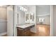 Bathroom features a granite countertop with under cabinet storage, and a view to the living room at 13601 E Marina Dr # 604, Aurora, CO 80014
